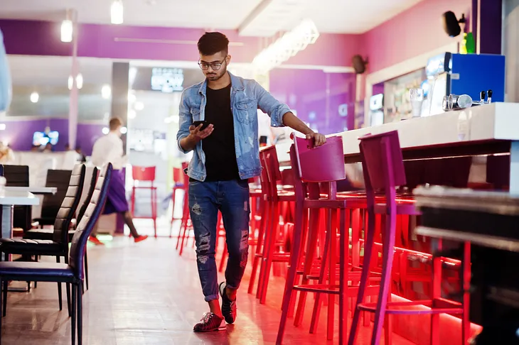 Person hanging near a bar