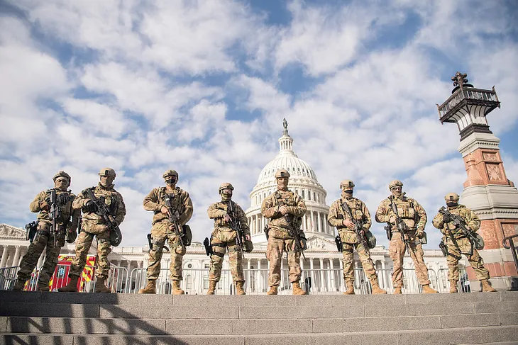 A picture of the east side of the U.S. Capitol being guarded by Army National Guard troops after the January 6, 2021, attack by insurrectionists.