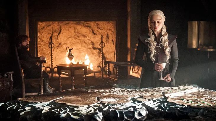 Daenerys and Tyrion discuss strategy while looking at a map in the seventh season of ‘Game of Thrones.’