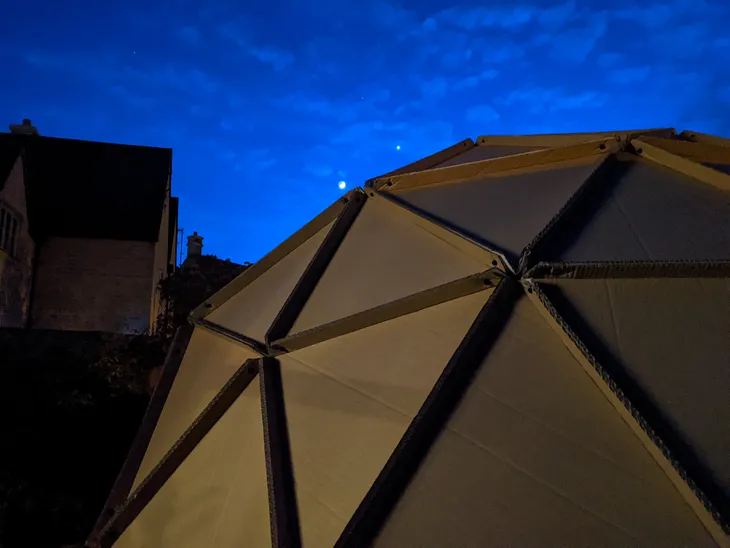 Cardboard dome with the moon and Venus visible in the sky