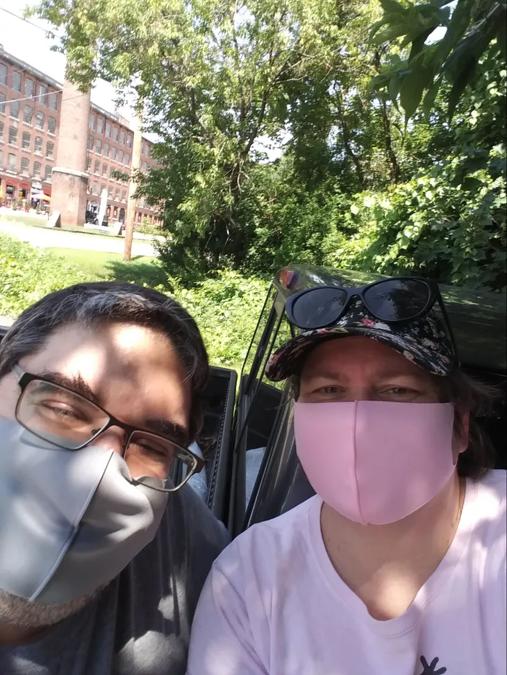 Picture of author and husband posing outside her hospital.