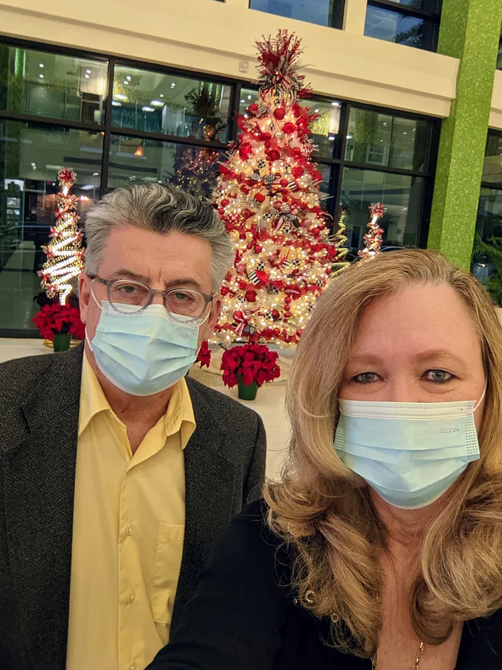 The author and his wife helping out at a Chrismas event.