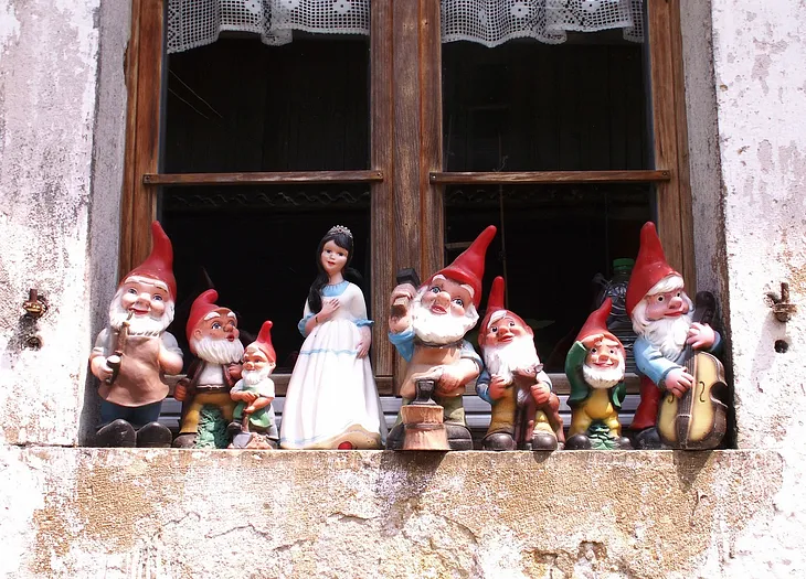 A picture of Snow White and the Seven Dwarfs sitting on a window sill