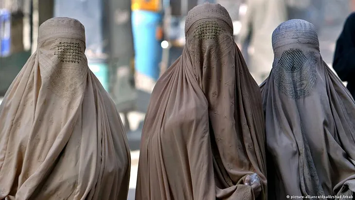 Muslim women by Islamic dress code.