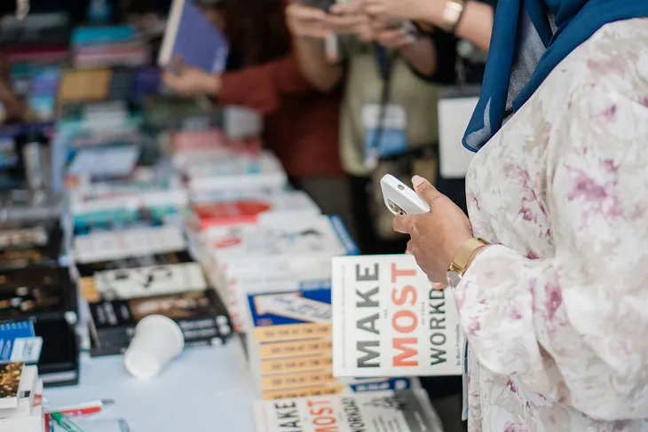 Book Fair Table Display with Books and People