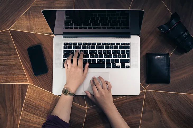 A woman managing her business on her computer