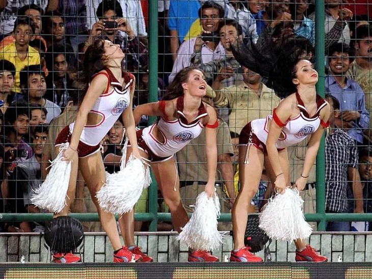 What are skimpily clad women cheerleaders doing in a cricket stadium?