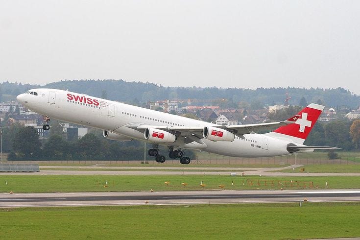 Classic power: A SWISS Airbus A340–313 at Zurich Airport, representing a rapidly disappearing generation of long-haul aviation.