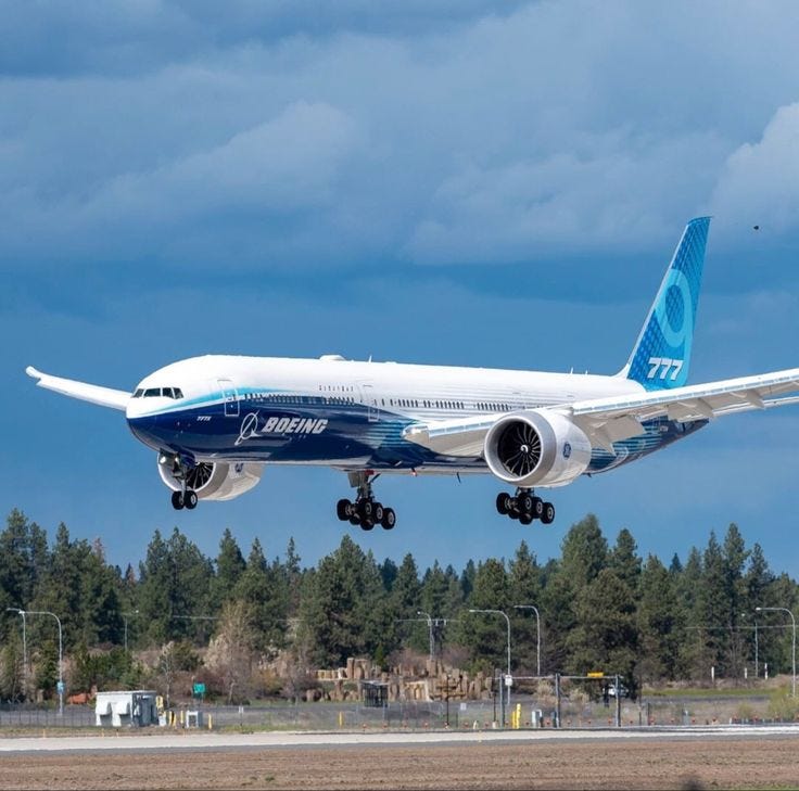 The massive Boeing 777–9 twinjet about to land