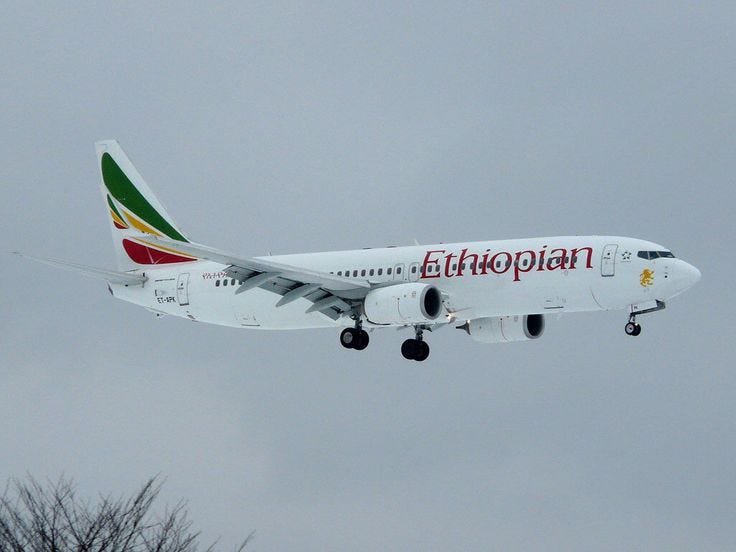 An Ethiopian Airlines Boeing 737 in flight, showcasing the airline’s iconic livery.