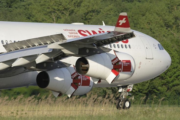 Precision in the details: A close-up view of the Swiss International Air Lines Airbus A340–313X. The ‘X’ designation marks this as one of the enhanced, higher-MTOW variants of the -300 series, which served as the workhorse of the SWISS long-haul fleet for over two decades. Its four-engine configuration and reliable performance defined the airline’s premium transatlantic and transpacific service during the peak of the quadjet era.