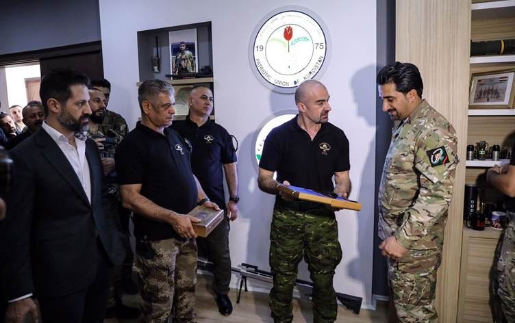 PUK co-chair Bafel Talabani and DPM Qubad Talabani appoint the new head of CTG Wahab Halabjayi (Photo: Eji Omer)