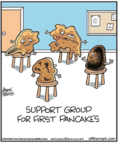 Cartoon illustration of four misshapen and burnt pancakes sitting on chairs in a circle, looking sad and dejected, as if attending a therapy session. The caption below reads, ‘Support group for first pancakes.’