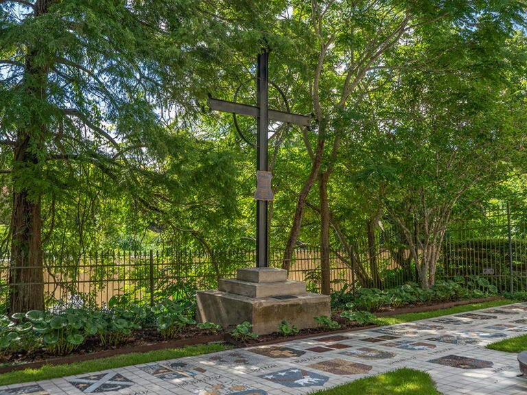 An iron memorial cross stands on the bank of Bayou Teche in St. Martinville. The original Deportation Cross in Grand Pre’ Nova Scotia marks the spot where Acadians were forced onto ships. 200 of those Acadians arrived near this site in Louisiana ten years after their deportation.