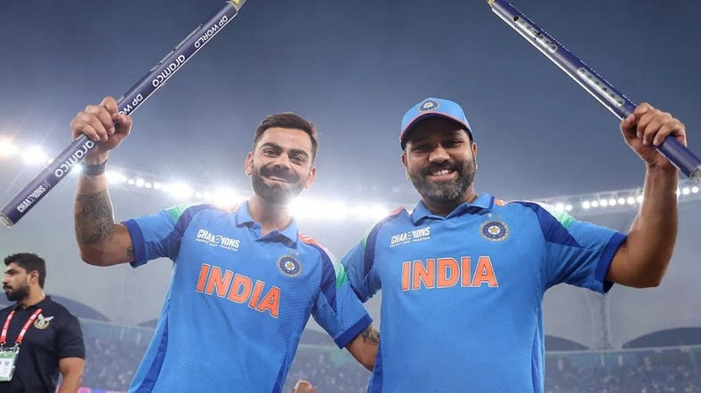 Virat Kohli and Rohit Sharma celebrate India’s victory, smiling and holding bats aloft under stadium lights — a moment of unity and triumph captured by Spin24star.