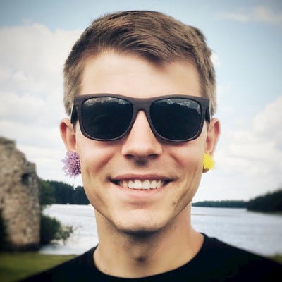 A happy Bob Massarczyk with flowers in his piercings.