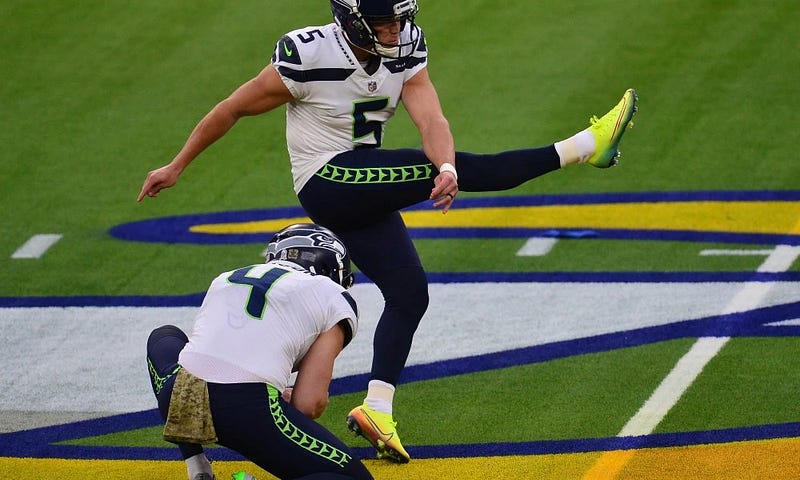Seahawks kicker Jason Myers swinging through a field goal off the holder