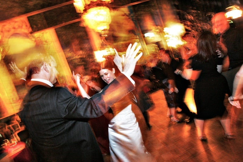 My stepfather and I, dancing at my wedding in 2005. Photo by John Hong.
