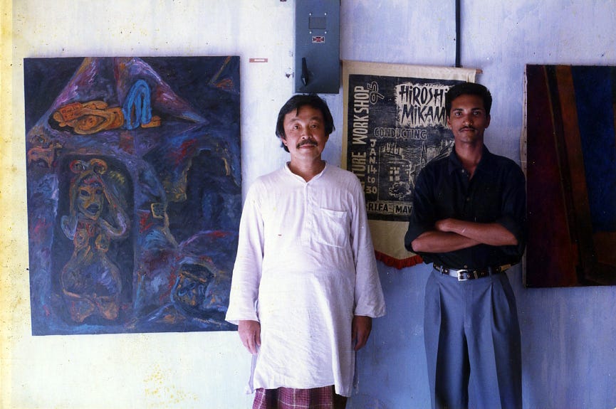 Renowned Japanese sculptor Hiroshi Mikami (1944–1999) and R. Gopakumar stand in front of one of the works from the Contrast series at the annual art exhibition of Mavelikkara Raja Ravi Varma College of Fine Arts in 1995.