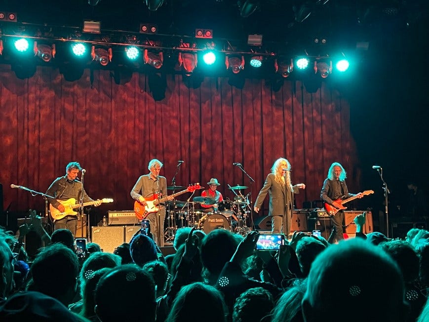 L-R: Jack Petruzzelli, Tony Shanahan, Jay Dee Daugherty, Patti Smith, Lenny Kaye