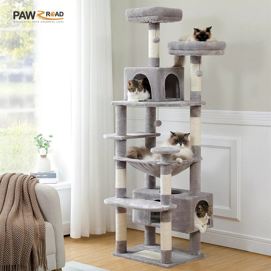 There is a cat scratching post with several cats in the picture