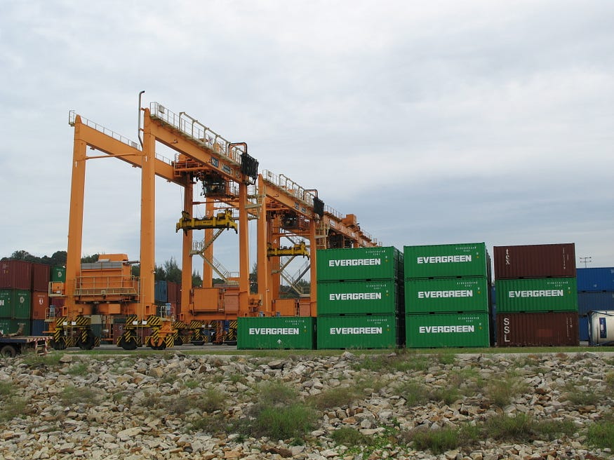 Picture of an RTG crane over a container stowage area.