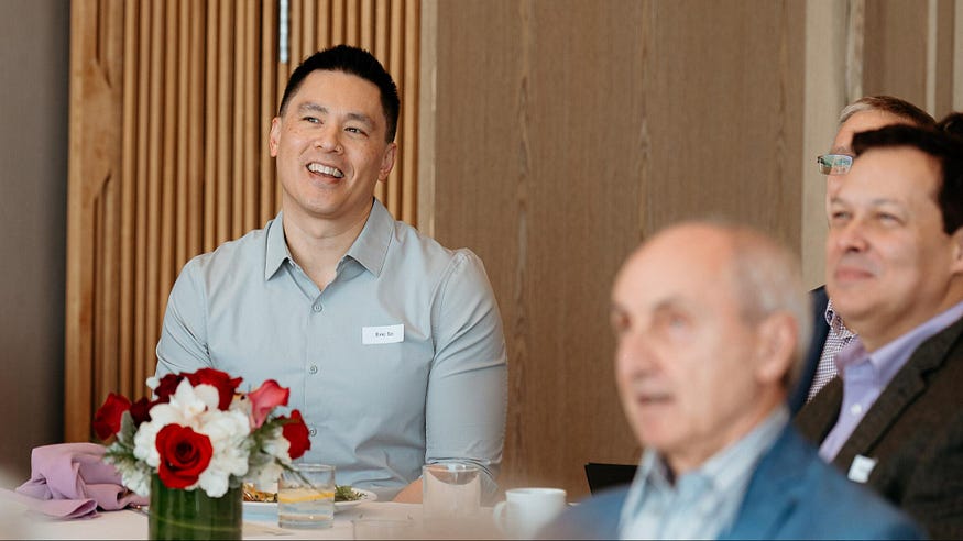 Eric So smiles as he receives his award for helping students use AI effectively.