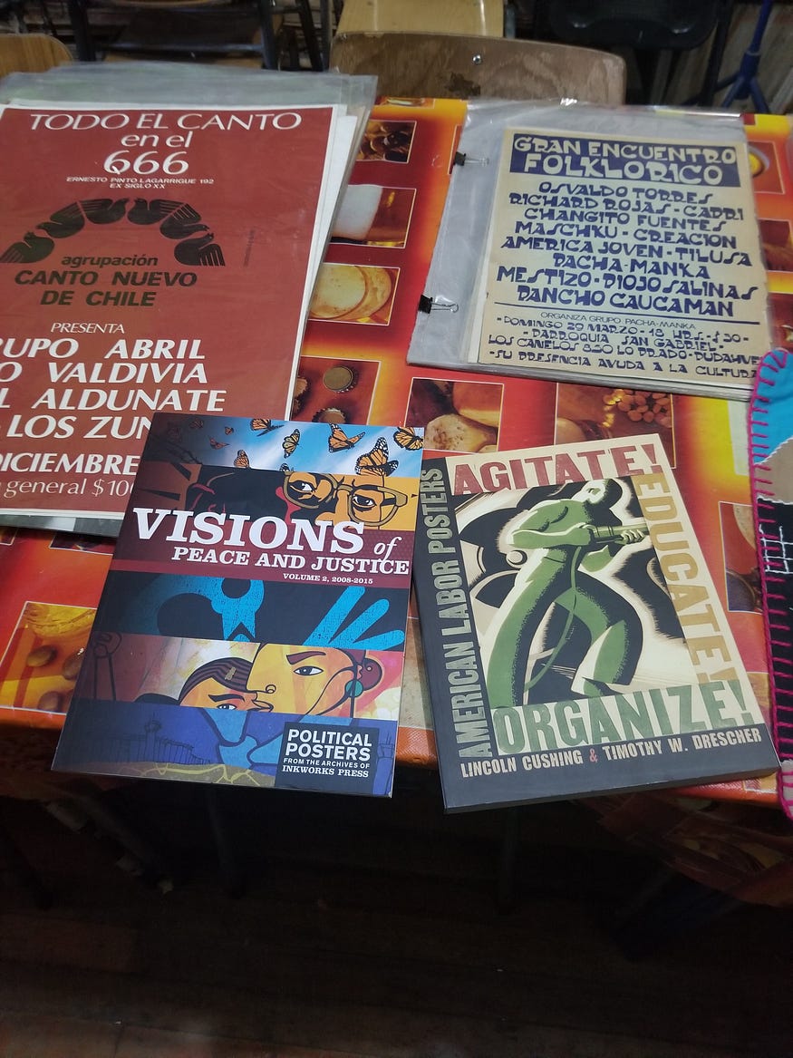 Photo of books, posters, and flyers from the Archive of the Graphic Resistance in Santiago, Chile