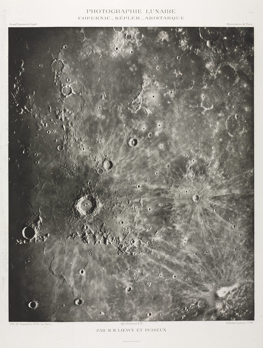 Vertically oriented, rectangular dark-inked image of the cratered surface of the moon with "PHOTOGRAPHIE LUNAIRE: COPERNIC-KEPLER-ARISTARIQUE" typed in uppercase above and the names of the photographers below. In the photogravure, a photograph etched into a metal plate then printed, the most craters are clustered in the lower left corner. Many of the craters appear as black specs rimmed in white, with white lines streaking out from them into the grey of the moon's surface.