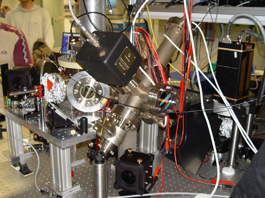 This ion trap, whose design is largely based on the work of Wolfgang Paul, is one of the early examples of an ion trap being used for a quantum computer. This 2005 photo is from a laboratory in Innsbruck, Austria, and shows the setup of one component of a now-outdated quantum computer. Nuclear clocks could lead to advances in quantum computing, as well. (Credit: Mnolf/Wikimedia Commons)