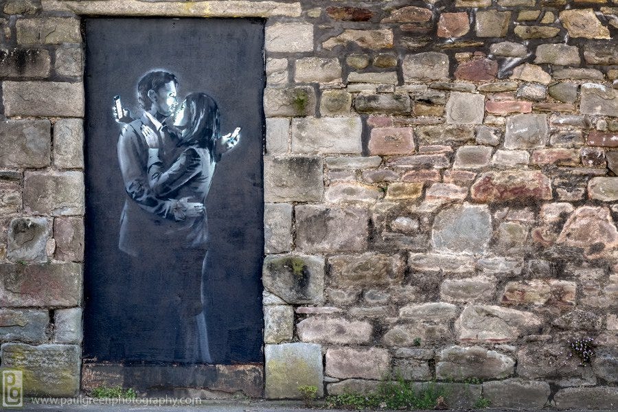Mobile Lovers” by Banksy. This image by Banksy, titled Mobile… | by Kyleigh  Dalkin | Medium