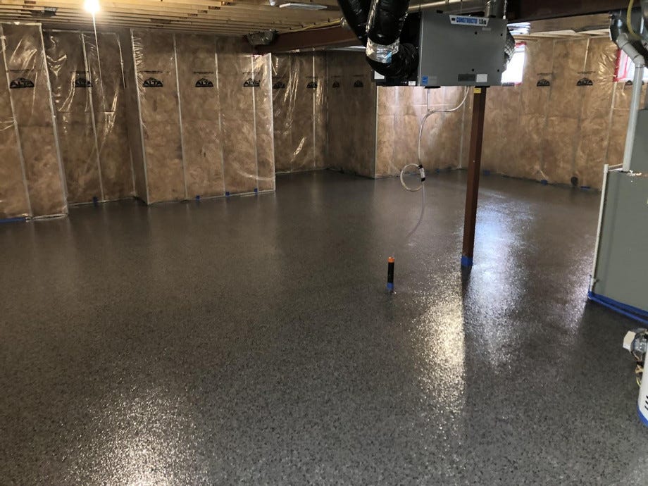 What does epoxy for garage floors consist of, and how effective is it