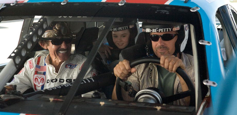 WISH FULFILLMENT: Bud gets to tool around in a NASCAR stock car with Richard “The King” Petty riding shotgun, and young Molly in the back.