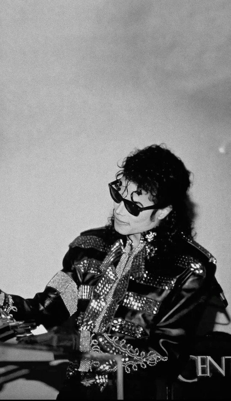 Michael Jackson during a press conference. Photo via Wikimedia Commons / Fair Use.