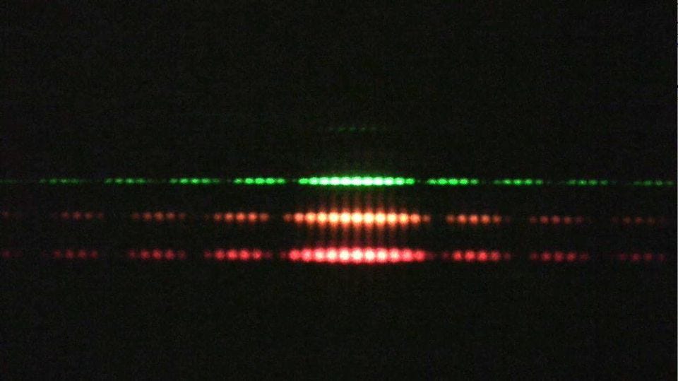 Double slit experiments performed with light produce interference patterns, as they do for any wave. The properties of different light colors is due to their differing wavelengths. (TECHNICAL SERVICES GROUP (TSG) AT MIT’S DEPARTMENT OF PHYSICS)