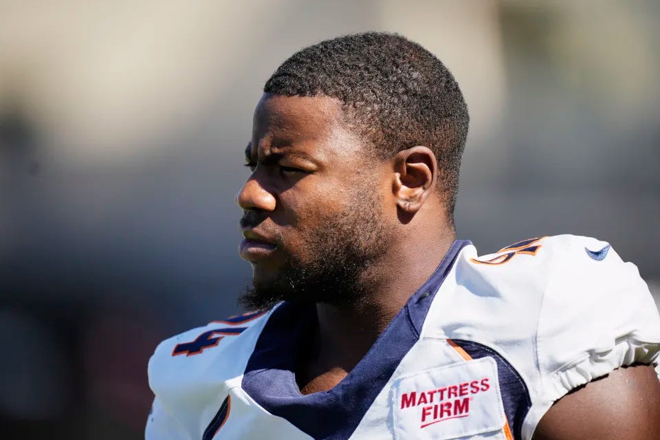 Denver Broncos Linebacker Aaron Patrick (94) warms up before