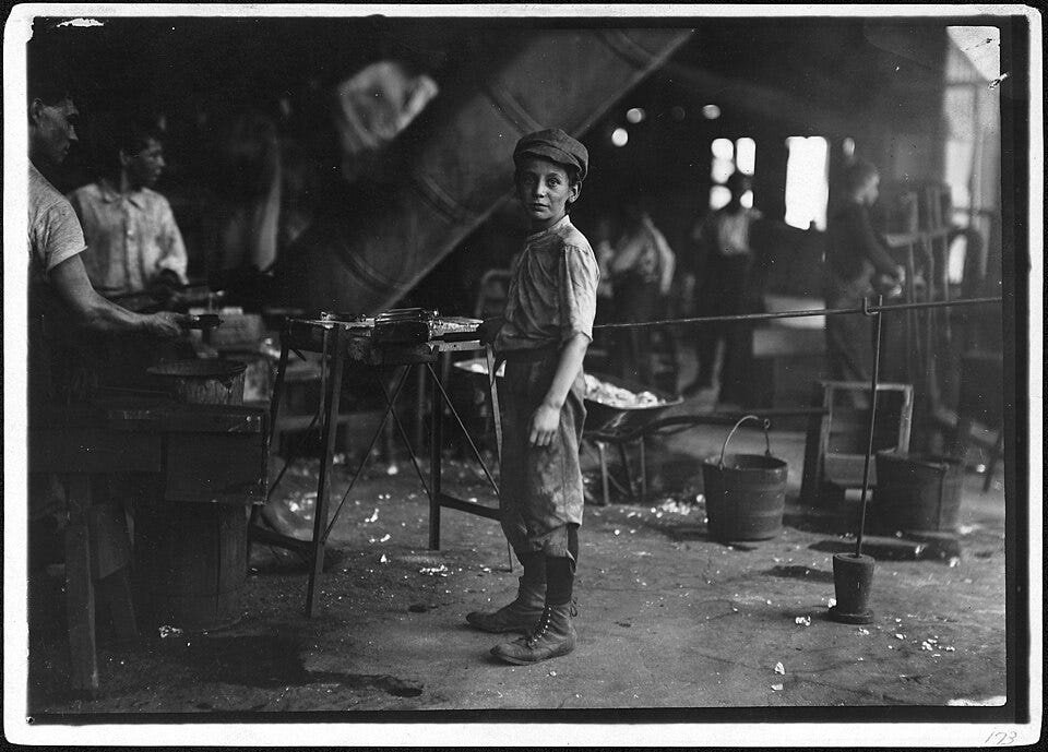 Rob Kidd working in an Indiana glass factory in 1908. More than a century before AI, industrial technologies were already transforming jobs, production, and working conditions. (Image by Lewis Hine, from Wikimedia Commons | Public domain image courtesy of the U.S. National Archives and Records Administration — NAID 523439)