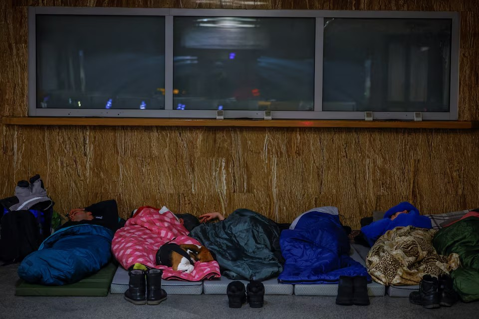 People sleep as they take shelter inside a metro station during a Russian overnight missile and drone strike, amid Russia’s attack on Ukraine, in Kyiv, Ukraine February 7, 2026. | Credit: REUTERS/Alina Smutko