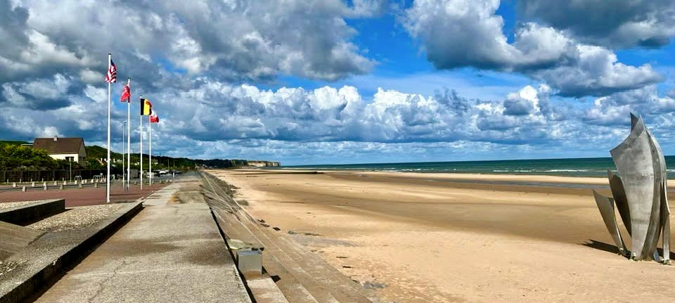 Omaha Beach at Normandy, today is a memorial site. This place is forever hallowed ground. Photo credit Nicolas Comarmi