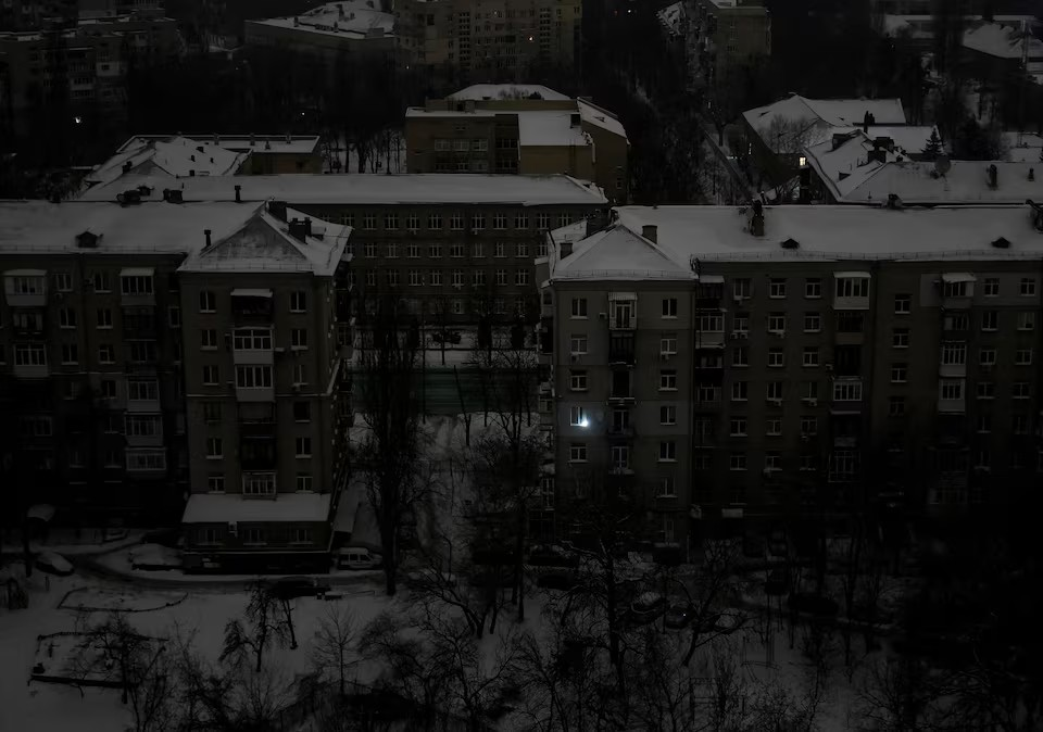 Residential buildings during a power blackout after critical civil infrastructure was hit by night’s Russian missile and drone attacks, amid Russia’s attack on Ukraine, in Kyiv, Ukraine February 7, 2026. | Credit: REUTERS/Gleb Garanich