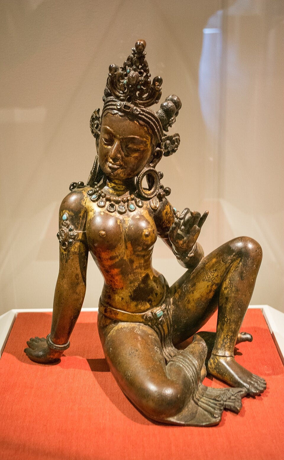 The Saundarya Lahari (Stream of Beauty) is a poetry written in the praise of Uma-Parvati, the Hindu goddess, wife of Shiva. While her other aspect, Kali is described in terms of her ferocity, her brows and eyes are taut and throwing fire at the enemy, in her calm aspect as Uma, she is often described in terms of her physical beauty and grace in devotional and traditional poetry and prose. (Image source: Wikimedia Commons, Uma 10th century gilt bronze from Nepal)