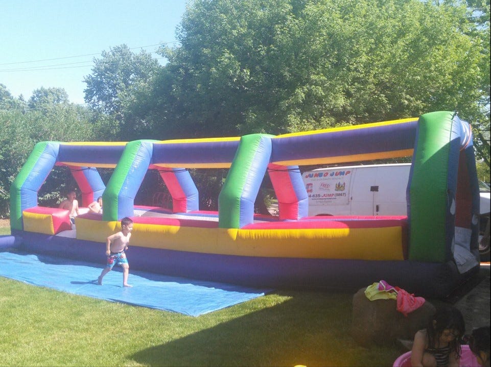 Slide into Fun with Jump and Slide Party Rentals in