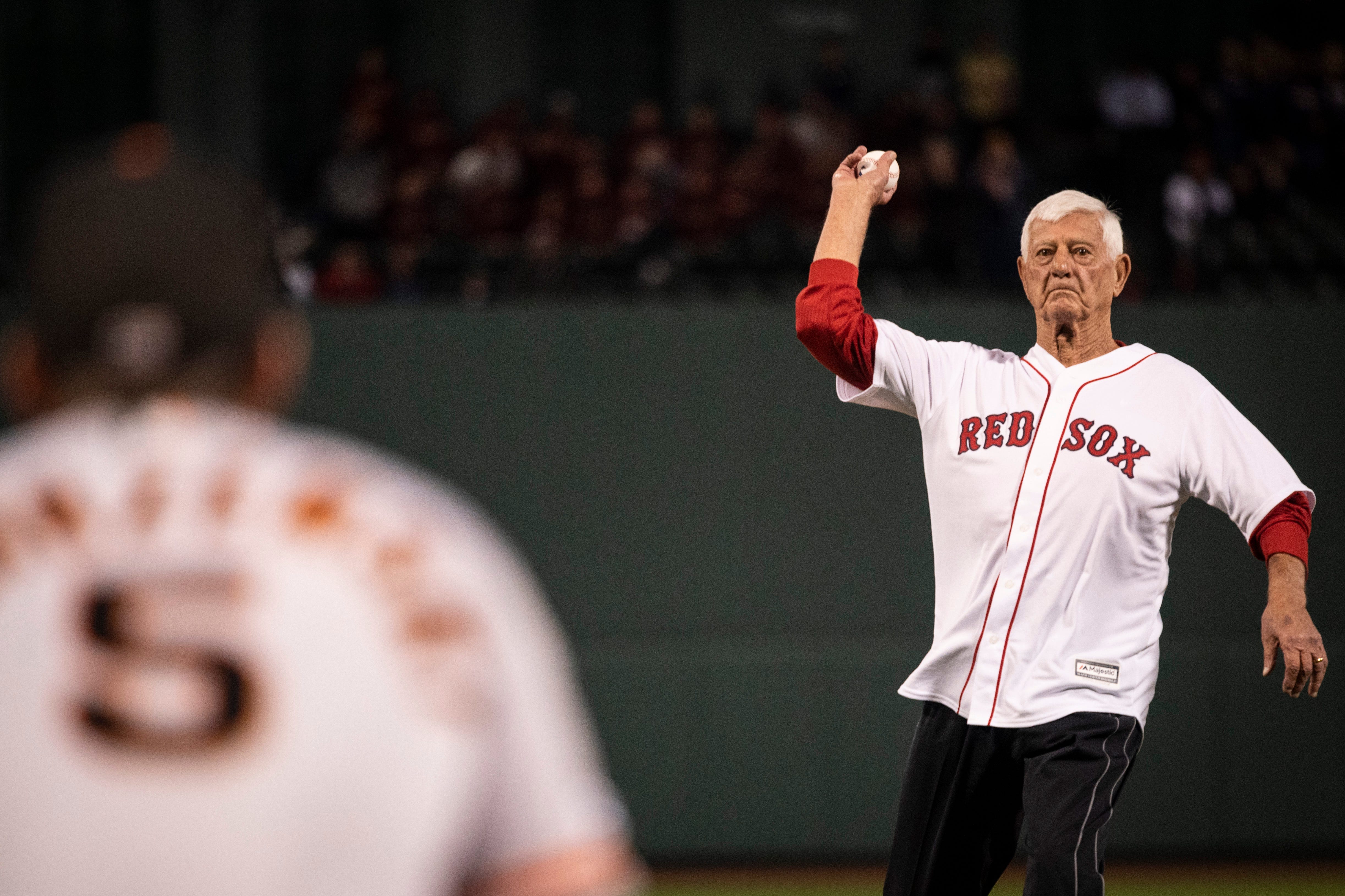 Red Sox player' Carl Yastrzemski throws a first pitch to his 29-year-old  Giants rookie grandson